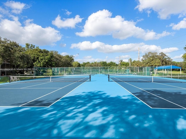 view of sport court featuring basketball hoop