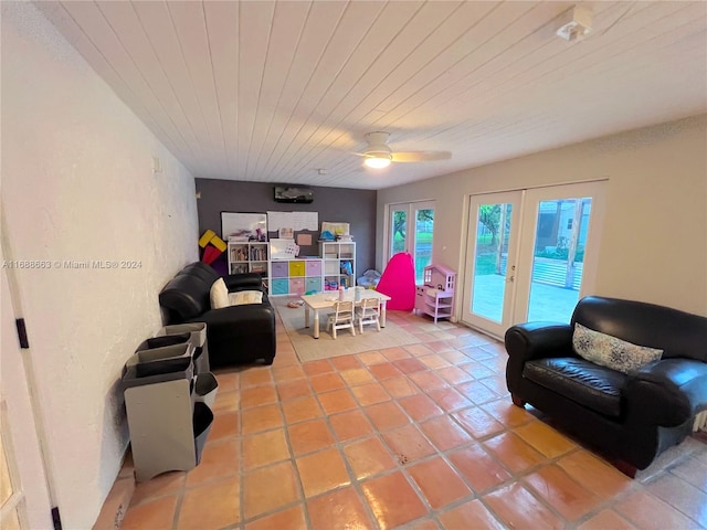 living room featuring french doors, ceiling fan, and tile patterned floors