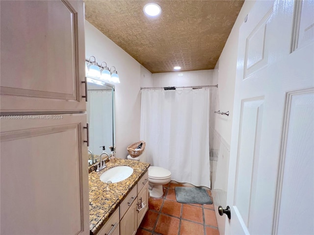 bathroom featuring toilet, vanity, and walk in shower