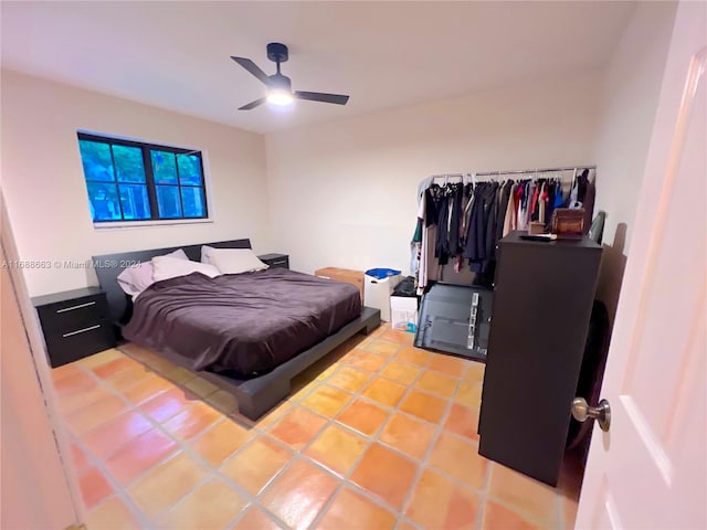 bedroom with tile patterned flooring and ceiling fan