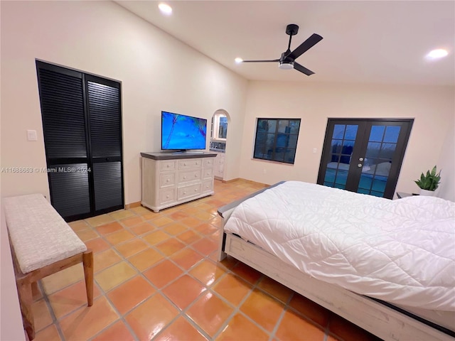 bedroom featuring ceiling fan, tile patterned floors, and french doors