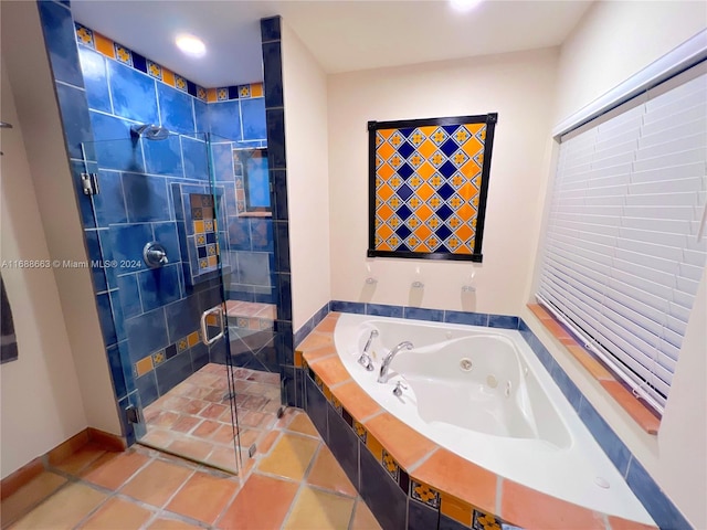 bathroom featuring tile patterned flooring and shower with separate bathtub