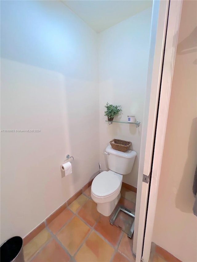 bathroom featuring tile patterned floors and toilet