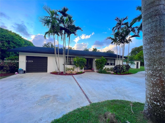 single story home with a garage