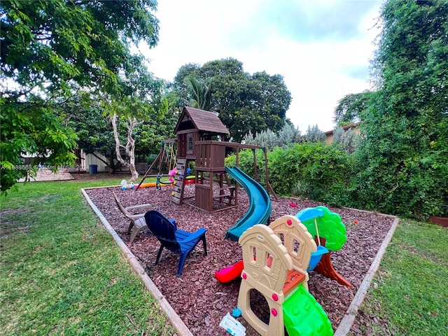 view of play area featuring a lawn