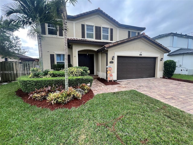 view of front of house featuring a garage and a front yard