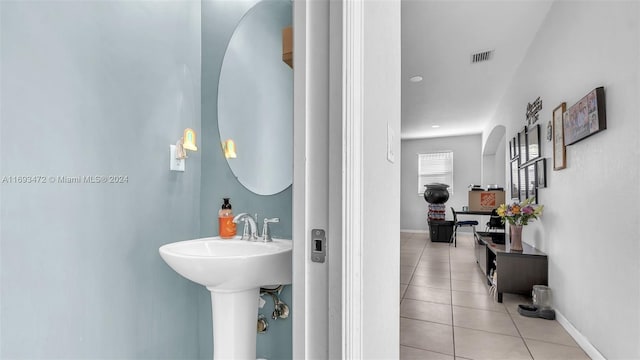 bathroom with tile patterned flooring