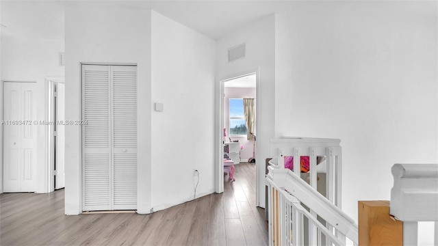 hall with light hardwood / wood-style flooring