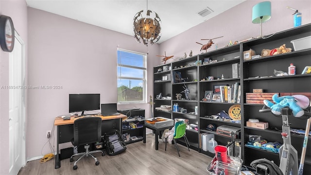 office space featuring a chandelier and wood-type flooring