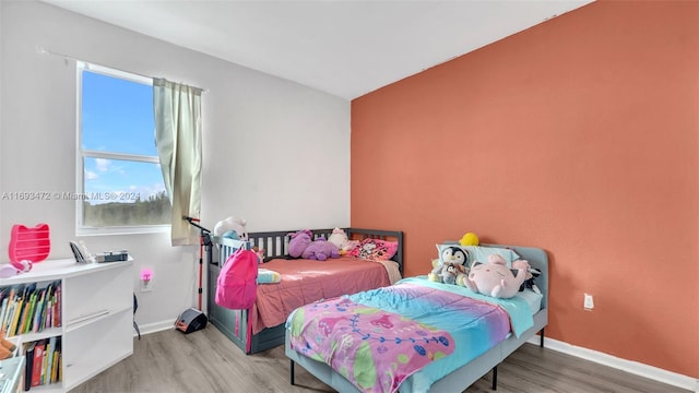 bedroom featuring wood-type flooring