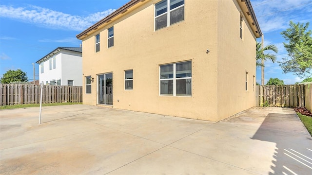 rear view of property featuring a patio area