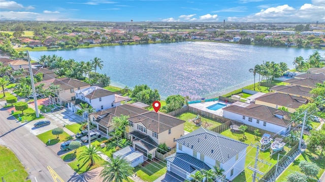 birds eye view of property featuring a water view