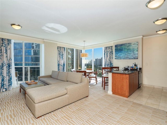 tiled living room featuring expansive windows and crown molding