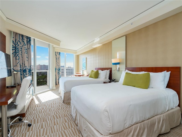 bedroom with light carpet, access to outside, and ornamental molding