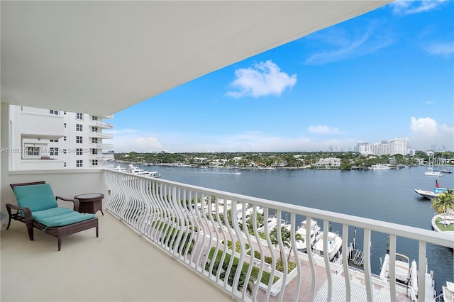 balcony featuring a water view