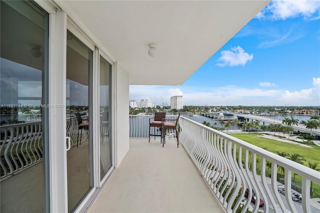 balcony featuring a water view