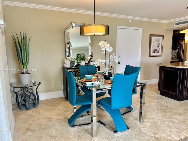 dining room featuring ornamental molding