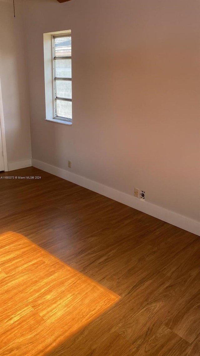 spare room with hardwood / wood-style flooring