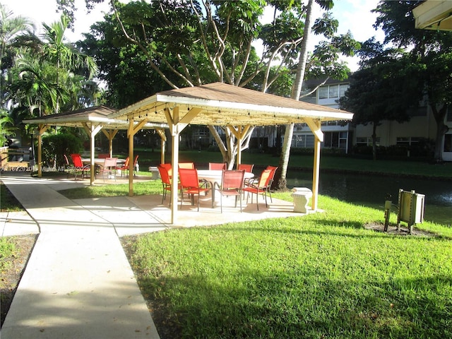 surrounding community with a patio and a lawn