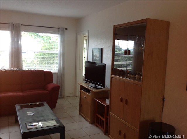 living room with light tile patterned floors