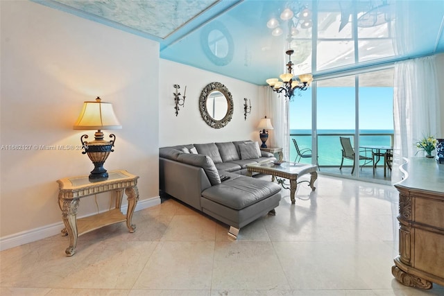 living room with a chandelier and a water view