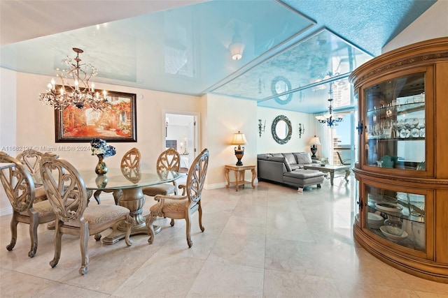 dining space with a notable chandelier