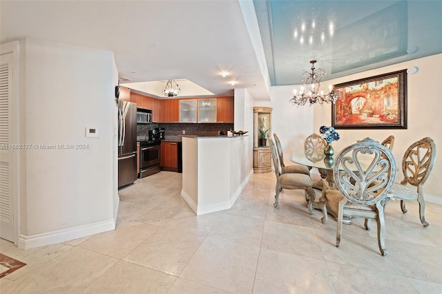 dining area with a chandelier and light tile patterned flooring