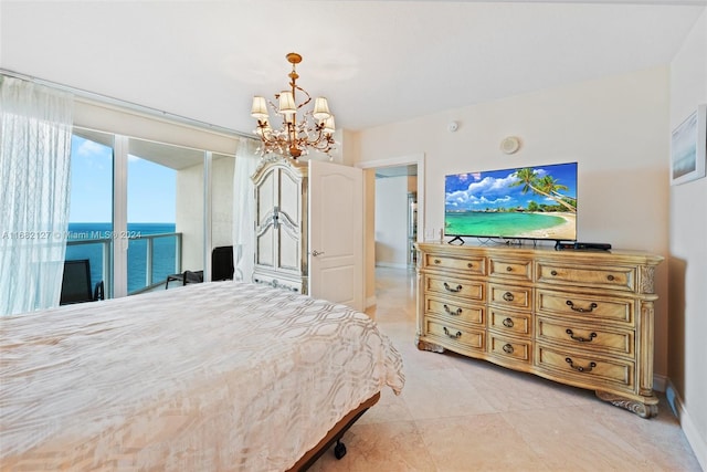 bedroom with an inviting chandelier and access to outside