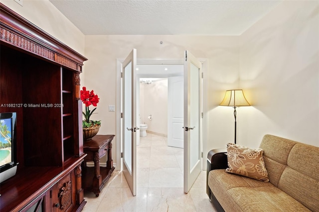 interior space with a textured ceiling