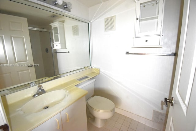 bathroom with vanity, walk in shower, tile patterned flooring, and toilet