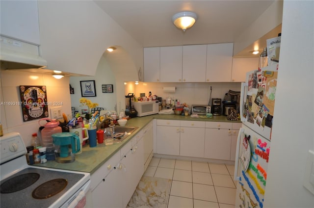 kitchen featuring white cabinets, decorative backsplash, sink, and white appliances