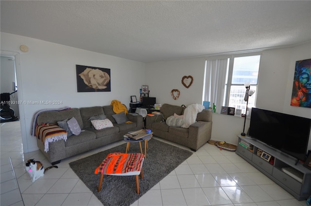 tiled living room with a textured ceiling