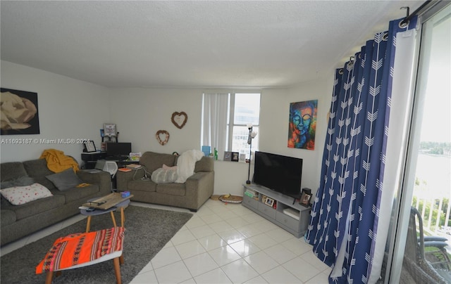 tiled living room with a textured ceiling