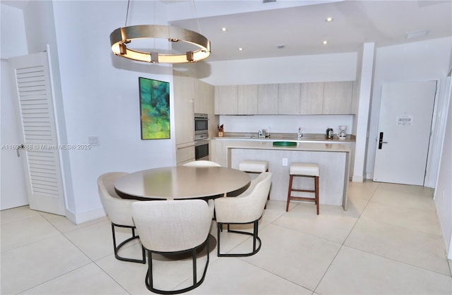 dining space featuring recessed lighting, baseboards, and light tile patterned floors