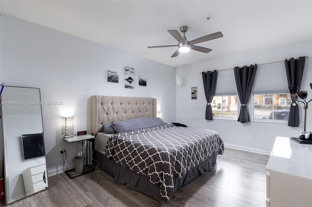 bedroom featuring hardwood / wood-style floors and ceiling fan