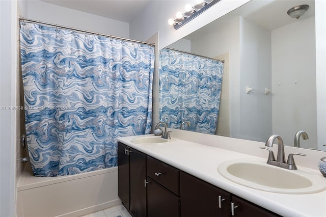 bathroom with tile patterned flooring, shower / bath combo, and vanity