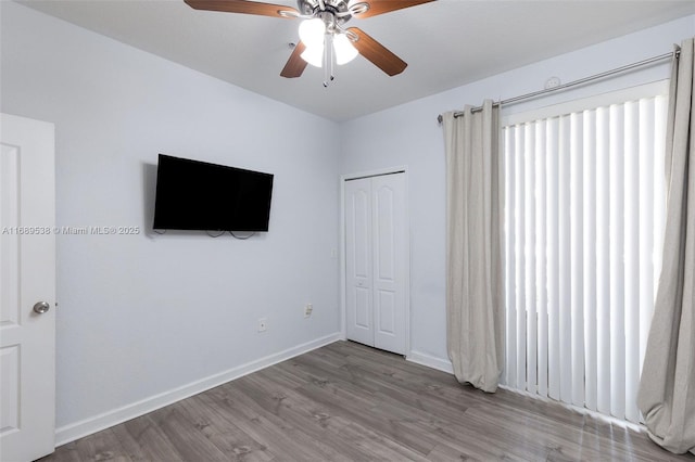 unfurnished bedroom with a closet, ceiling fan, and light hardwood / wood-style floors