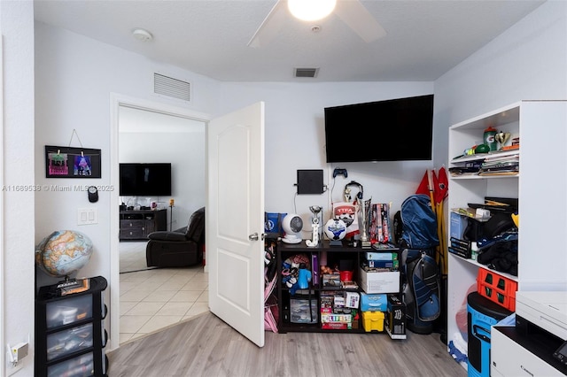 interior space with ceiling fan and light wood-type flooring