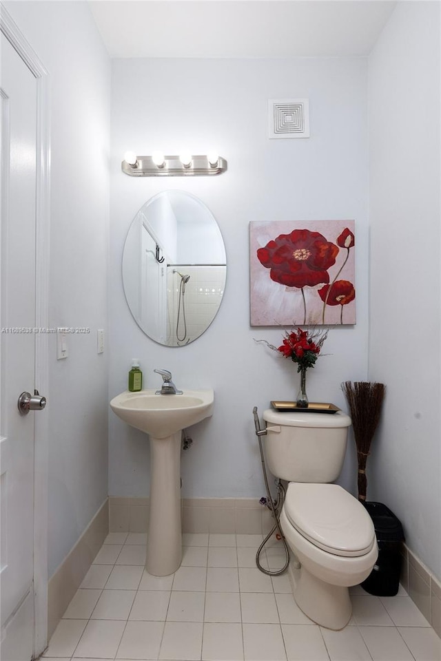 bathroom featuring tile patterned floors and toilet