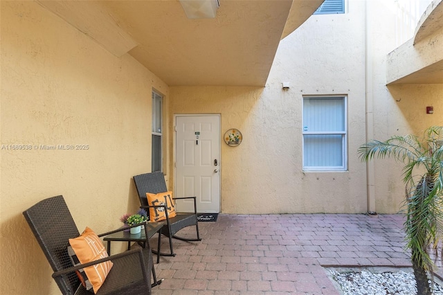 entrance to property with a patio area