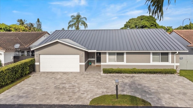 single story home with a garage