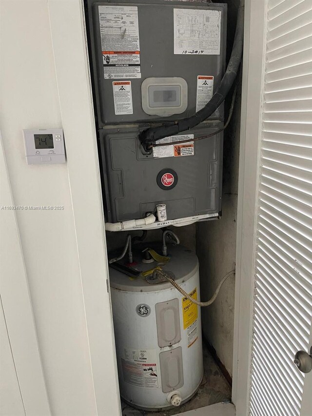 utility room with electric water heater