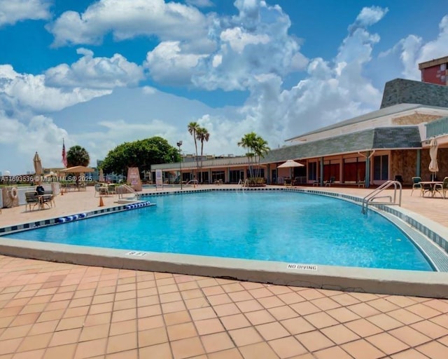 pool with a patio area