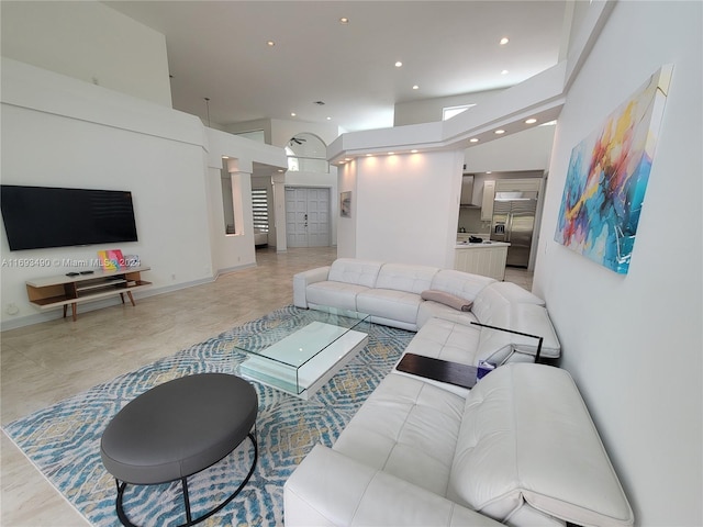 living room featuring ornate columns