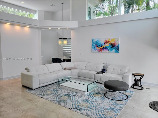 living room featuring a towering ceiling