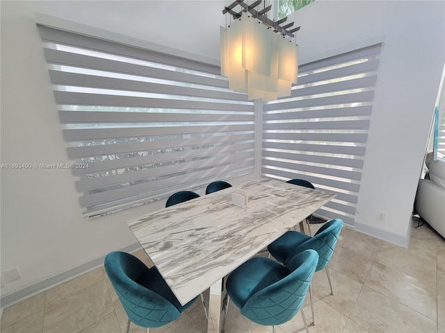 dining space with light tile patterned floors