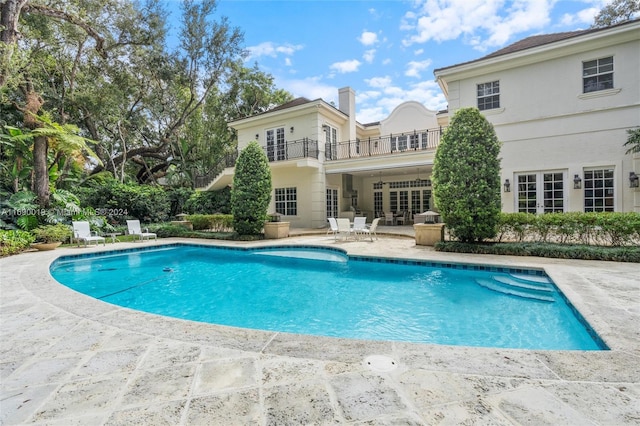 view of pool featuring a patio