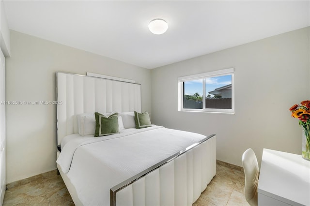 bedroom featuring baseboards