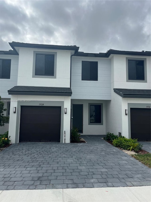 view of front of property with a garage