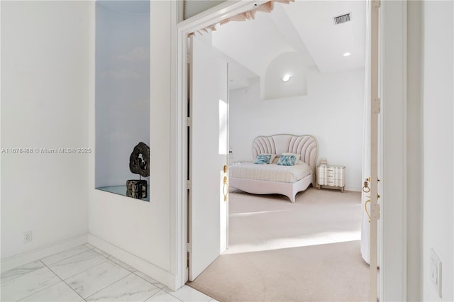 hallway with visible vents, recessed lighting, marble finish floor, and baseboards